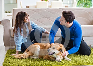 Happy family with golden retriever dog