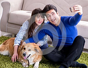 Happy family with golden retriever dog