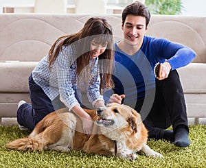 Happy family with golden retriever dog