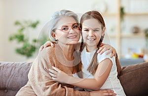 Happy family grandma and granddaughter hugging