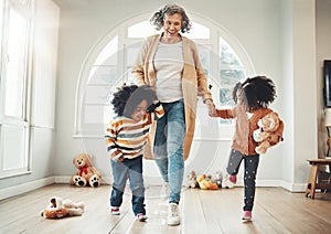 Happy family, grandmother and children play hopscotch in home having fun, enjoy games and relax in bedroom. Bonding