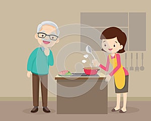 Elderly man looking to lovely woman cooking in kitchen