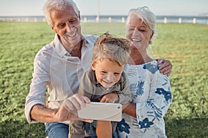 Happy family, grandparents and child take a selfie in nature with a phone camera for bonding memories outdoors. Smile