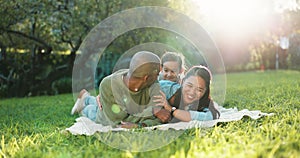 Happy family, grass and parents on a picnic with child in a park for trust, support and happiness together. Love, care
