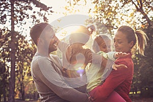 Happy family in group hug.