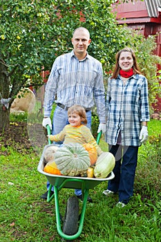 Happy family with harvest