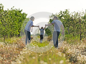 The happy family has a rest outdoors