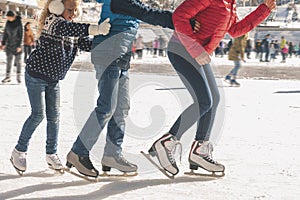 Happy family have outdoor activity, Christmas, outdoor ice skating rink photo