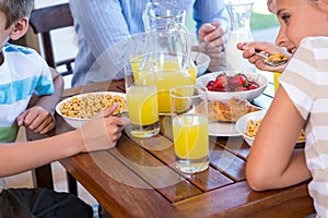 Happy family having breakfast together