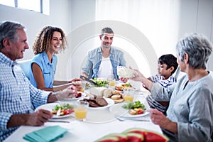 Happy family having breakfast together