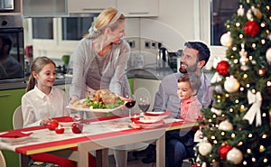 Happy family having Christmas dinner