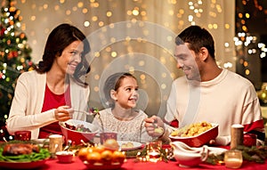 Happy family having christmas dinner at home