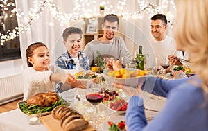 Happy family having dinner party at home