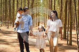 Happy family having fun with activities together in park on weekend