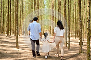 Happy family having fun with activities together in park on weekend