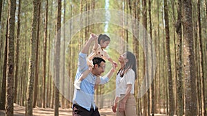 Happy family having fun with activities together in park on weekend