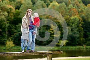 Happy family having fun on autumn day