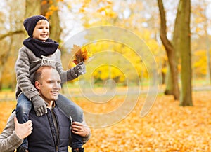 Happy family having fun in autumn park