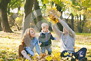 Happy family having fun in autumn urban park