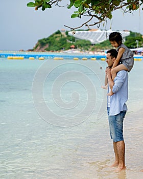 Happy family having fun at the beach