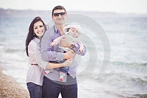 Happy family having fun on the beach