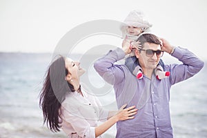 Happy family having fun on the beach