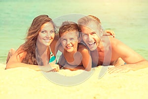 Happy family having fun at the beach