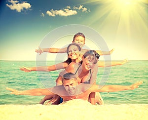 Happy family having fun at the beach