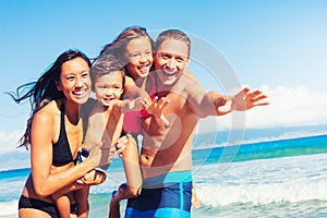 Happy Family Having Fun at the Beach