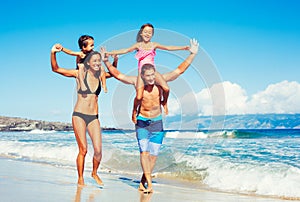 Happy Family Having Fun at the Beach