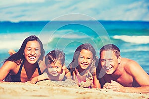 Happy Family Having Fun at the Beach