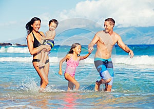 Happy Family Having Fun at the Beach