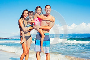 Happy Family Having Fun at the Beach