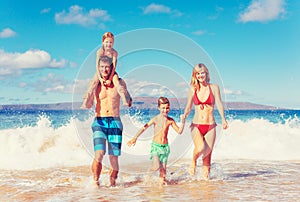 Happy Family Having Fun on the Beach