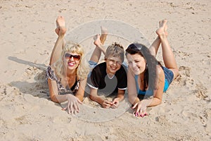 Happy family having fun on the beach