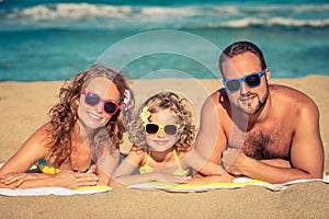 Happy family having fun on the beach