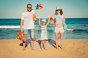 Happy family having fun on the beach