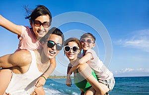 Happy Family Having Fun at the Beach