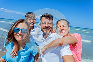Happy family having fun at beach together. Fun happy lifestyle in the summer leisure