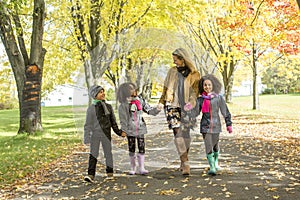 Happy family having fun on beautiful autumn day