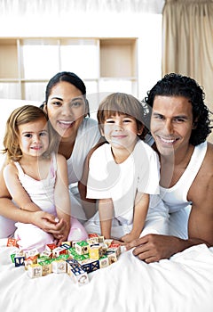 Happy family having fun with cube toys