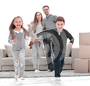 happy family having fun in a new apartment