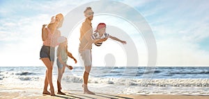 Happy family having fun on sandy beach near sea, space for text. Banner design