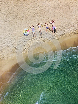 Happy family having fun in the summer leisure. Aerial drone bird`s eye view photo.