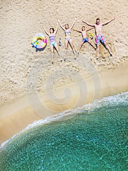 Happy family having fun in the summer leisure. Aerial drone bird`s eye view photo.