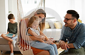 Happy family having fun time at home. Parents children love happiness concept.