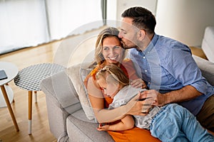 Happy family having fun time at home. Parents children love happiness concept.