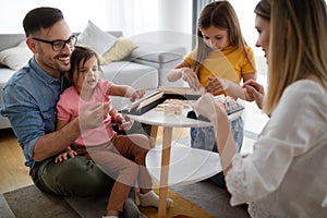 Happy family having fun times at home