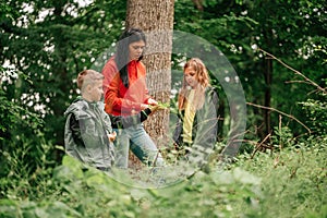 Happy family having fun together in forest