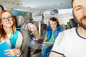 Happy family having fun travelling by car